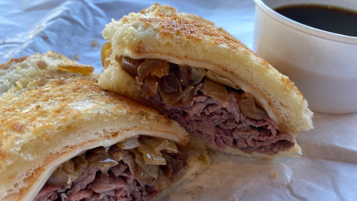 This melt version of Adamson's French Dip adds grilled onions and cheese to the oak-smoked slices of top sirloin. (Bay Area News Group)