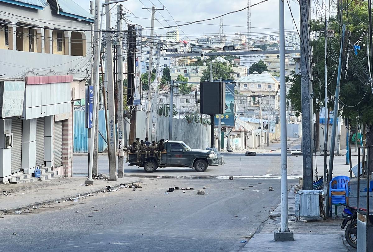 A truck carrying Somali security forces drives across a street ahead of a protest against Somalia's President Hassan Sheikh Mohamud, where opposition leaders say his term ended in mid-May, while the president and his allies say he is allowed to stay on for a year until elections are held, in Mogadishu, Somalia, June 4, 2026. Picture taken using a mobile phone. REUTERS/Feisal Omar