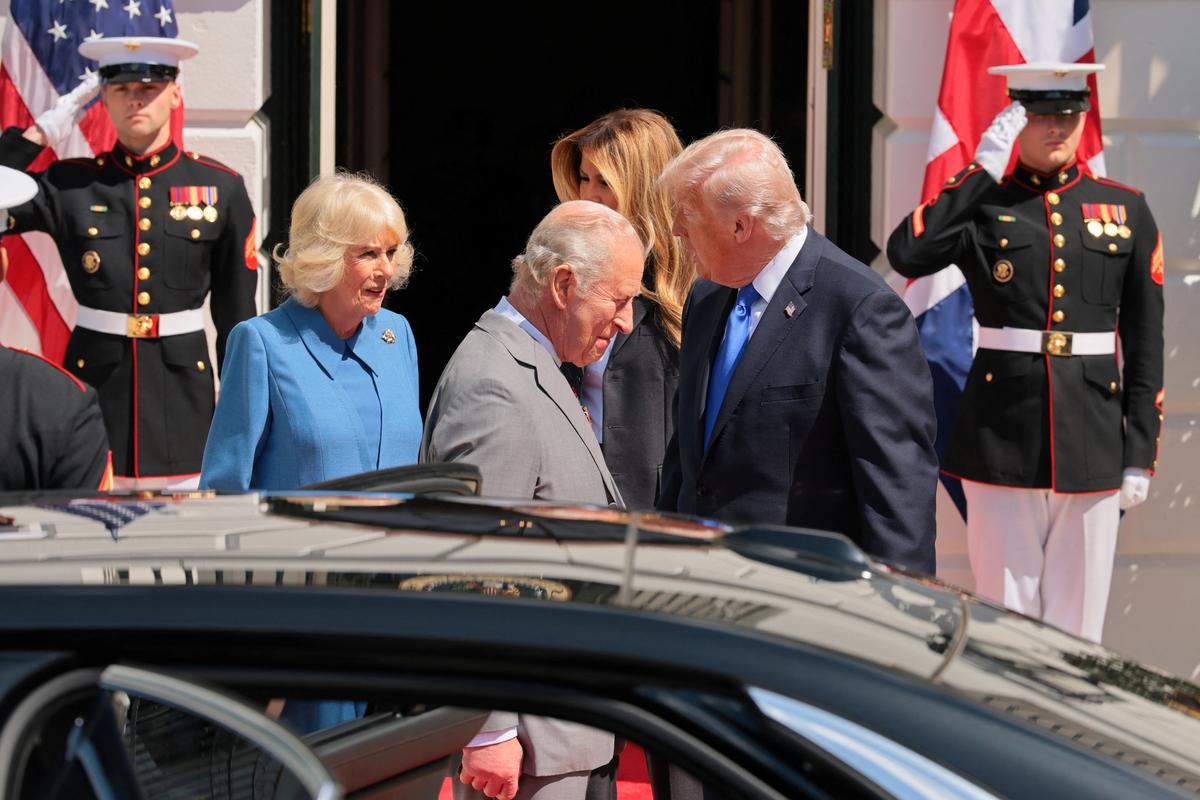 U.S. President Donald Trump and first lady Melania Trump speak with Britain's King Charles and Queen Camilla as they depart Washington on the final day of their state visit, at the White House in Washington, D.C., U.S., April 30, 2026. REUTERS/Jonathan Ernst