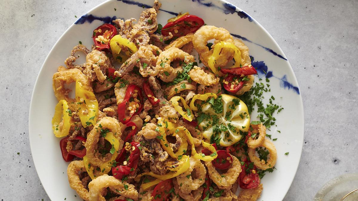 This image shows a recipe for Rhode Island–Style Fried Calamari by Dan Rinaldi, a firefighter in Providence, R.I., from “The Great American Recipe Cookbook,” a new PBS series that gathers 10 home cooks from all over the country and gives them the opportunity to showcase their beloved signature dishes. (Fred + Elliott via AP)