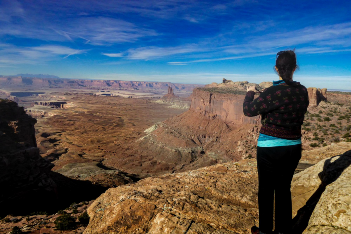  From the end of the Grand View Plateau at the canyon's rim, in the distance, the Colorado River weaves its way to the confluence with the Green River. Photo credit: Eric Jay Toll 
