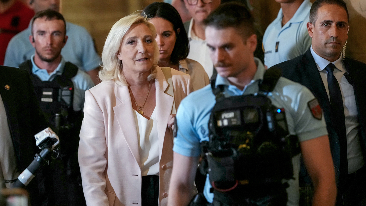 President of Rassemblement National parliamentary group Marine Le Pen (C-L) leaves after the verdict in the appeal trial of RN former or actual members on charges of embezzlement of European public funds in a case of alleged European Parliament fake jobs at Paris Court of Appeal on July 7, 2026. An appeals court on July 7, 2026, handed France's far-right chief Marine Le Pen a one-year term with an ankle tag over a fake jobs scam in the European parliament, casting doubt on whether she will run for president next April. The court also prevented her from running for office for 15 months, a ban expected to have expired this year. (Dimitar Dilkoff/AFP/Getty Images/TNS)