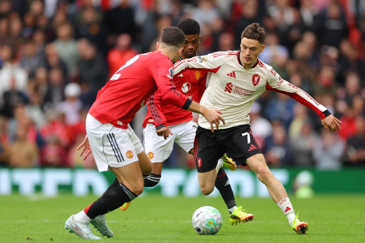  Florian Wirtz of Liverpool takes on Diogo Dalot of Manchester Utd  during the Premier League match between Manchester United and Liverpool at Old Trafford on May 3, 2026 in Manchester, United Kingdom. (Photo by Shaun Brooks - CameraSport via Getty Images) Photo by Shaun Brooks - CameraSport via Getty Images