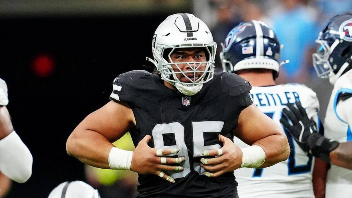  Oct 12, 2025; Paradise, Nevada, USA; Las Vegas Raiders defensive tackle Thomas Booker (99) reacts after a play during the second half against the Tennessee Titans at Allegiant Stadium. Mandatory Credit: Stephen R. Sylvanie-Imagn Images | Stephen R. Sylvanie-Imagn Images 
