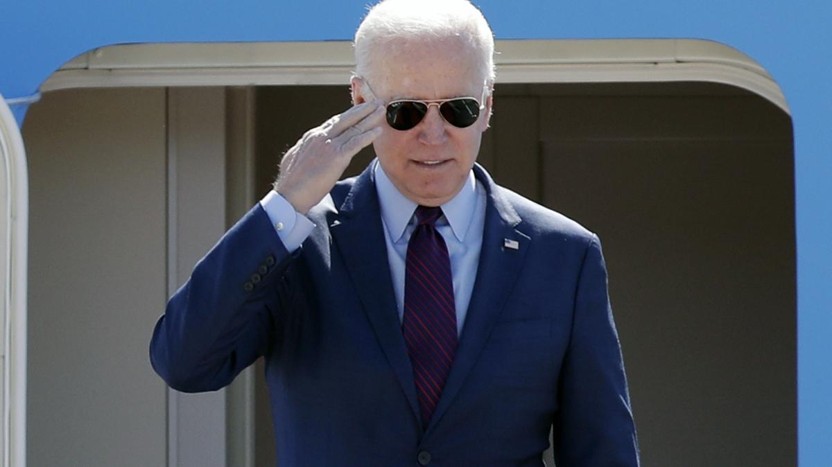 President Joe Biden salutes from the stairs of Air Force One at Andrews Air Force Base, Md., Tuesday on his departure for Detroit to visit the Ford Rouge Electric Vehicle Center in Dearborn, Mich. (AP Photo/Luis M. Alvarez)