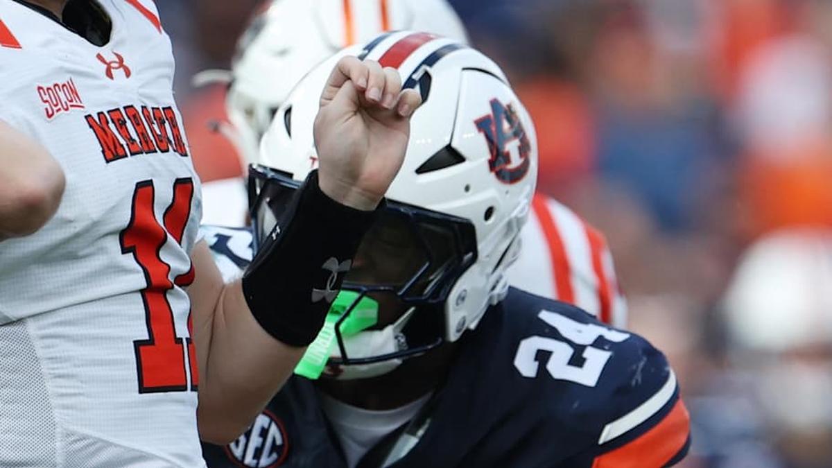  Nov 22, 2025; Auburn, Alabama, USA; Mercer Bears quarterback Braden Atkinson (11) throws a pass as Auburn Tigers defensive end Keyron Crawford (24) closes in during the second quarter at Jordan-Hare Stadium. Mandatory Credit: John Reed-Imagn Images | John Reed-Imagn Images 