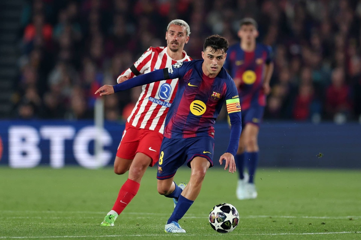  Antoine Griezmann, and Pedri during the UEFA Champions League match between FC Barcelona v Atletico Madrid. Photo by David Ramirez/Soccrates/Getty Images