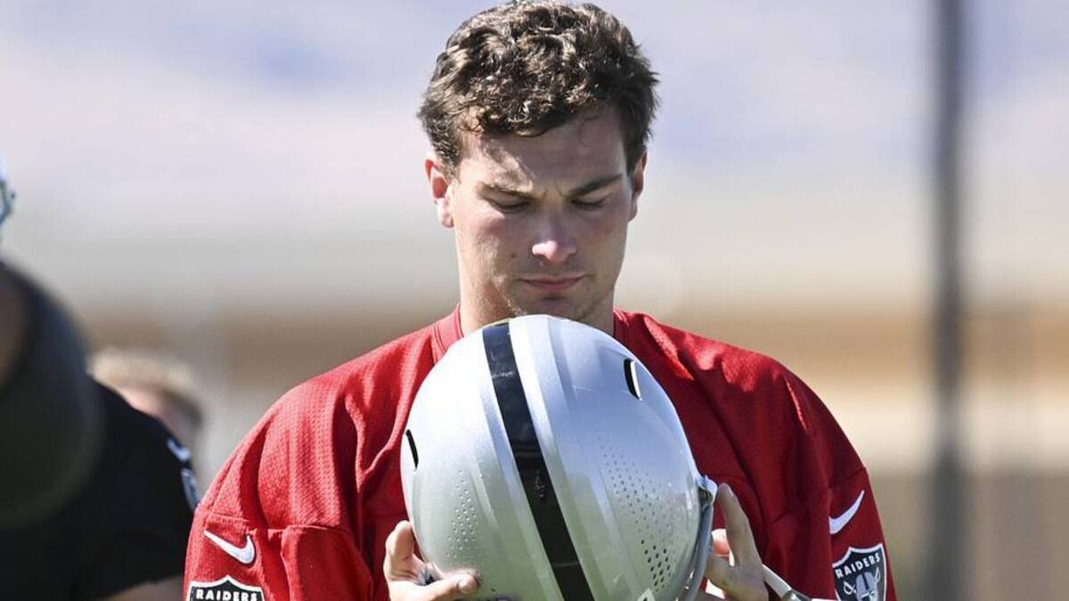  May 20, 2026; Henderson, NV, USA; Las Vegas Raiders quarterback Fernando Mendoza (15) stretches during organized team activities at Intermountain Health Performance Center. Mandatory Credit: Candice Ward-Imagn Images | Candice Ward-Imagn Images 