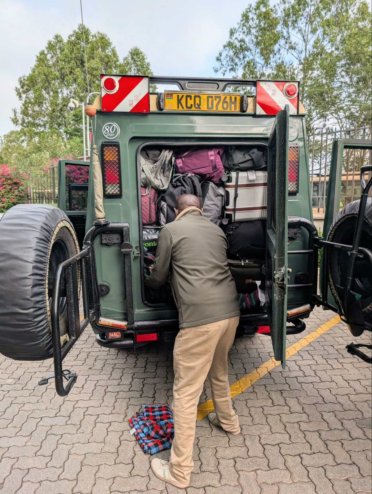 Our Capture Kenya safari guides had a daily Tetris challenge: Getting 11 people's luggage packed into three vehicles. Photo credit: Cindy Richards
