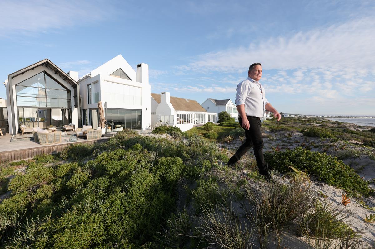 SJ du Venage, a provincial councilman for Freedom Front Plus, a right-wing, white Afrikaner political party, outside his residence in Saint Helena Bay, Western Cape, South Africa, May 20, 2026. Du Venage has applied for the U.S. refugee programme. REUTERS/Esa Alexander