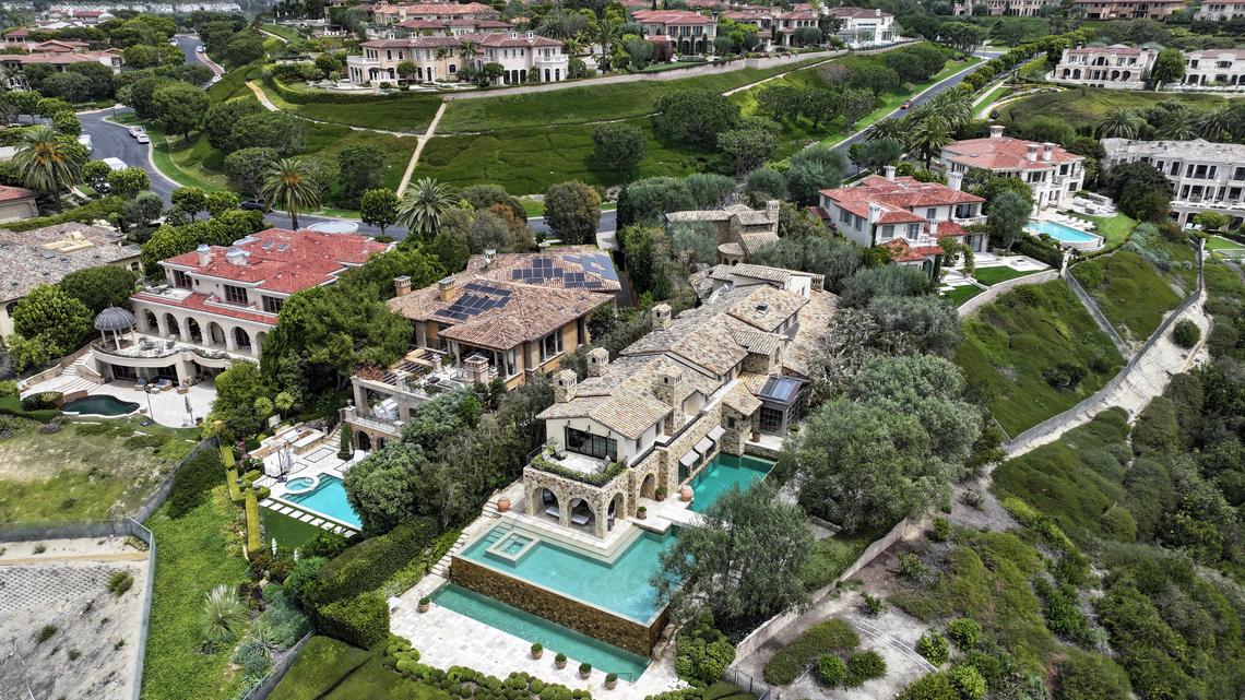 This 13,206-square-foot Pelican Crest estate in Newport Coast sold for $30 million at the end of March in Newport Beach, CA. Designed by architect Richard Landry, the stone-clad Tuscan villa features a subterranean speakeasy-style bar with underwater views into the two-level infinity-edge pool. From its half-acre perch, the property offers views of the ocean, coastline and golf course. Photographed on Thursday, April 16, 2026,  (Photo by Jeff Gritchen, Orange County Register/SCNG)
This 13,206-square-foot Pelican Crest estate in Newport Coast sold for $30 million at the end of March. Designed by architect Richard Landry, the stone-clad Tuscan villa features a subterranean speakeasy-style bar with underwater views into the two-level infinity-edge pool. From its half-acre perch, the property offers views of the ocean, coastline and golf course.
