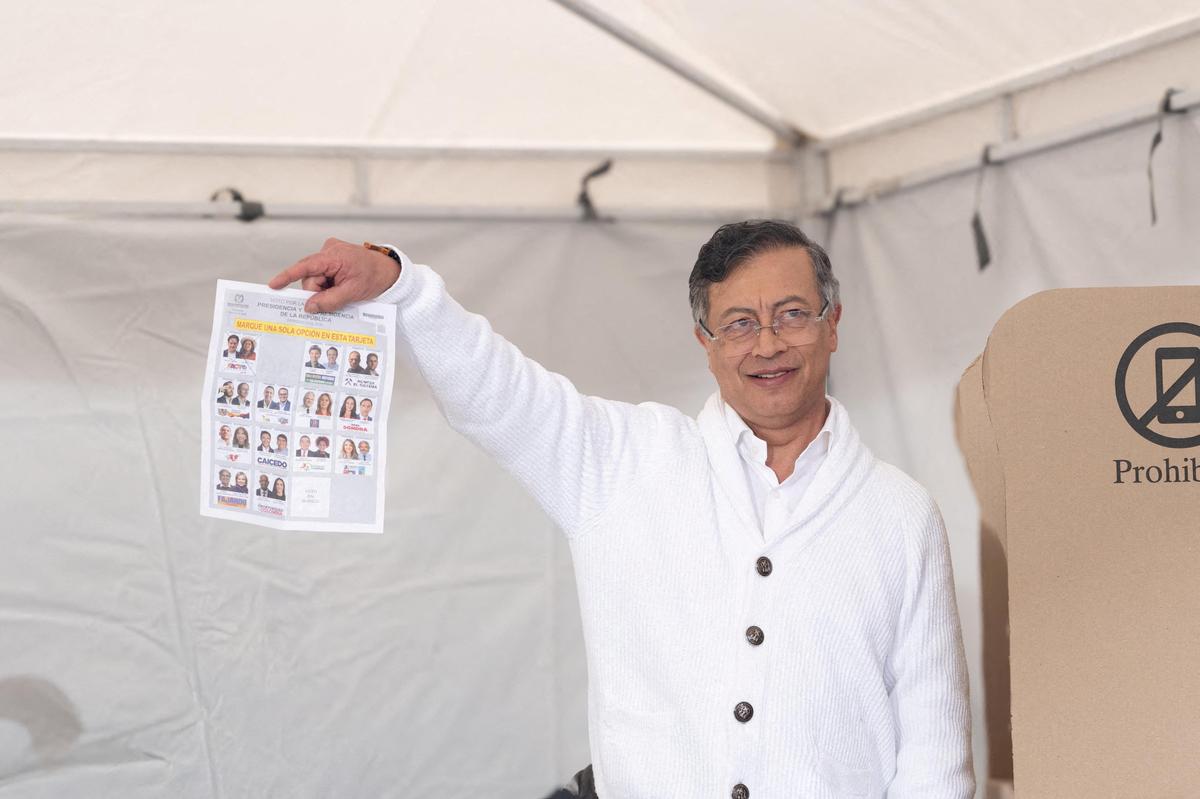 Colombian President Gustavo Petro shows the media his ballot before casting his vote at the Congress of the Republic during the first round of the presidential election, in Bogota, Colombia, in this handout photo released on May 31, 2026. Colombian Presidency/Handout via REUTERS