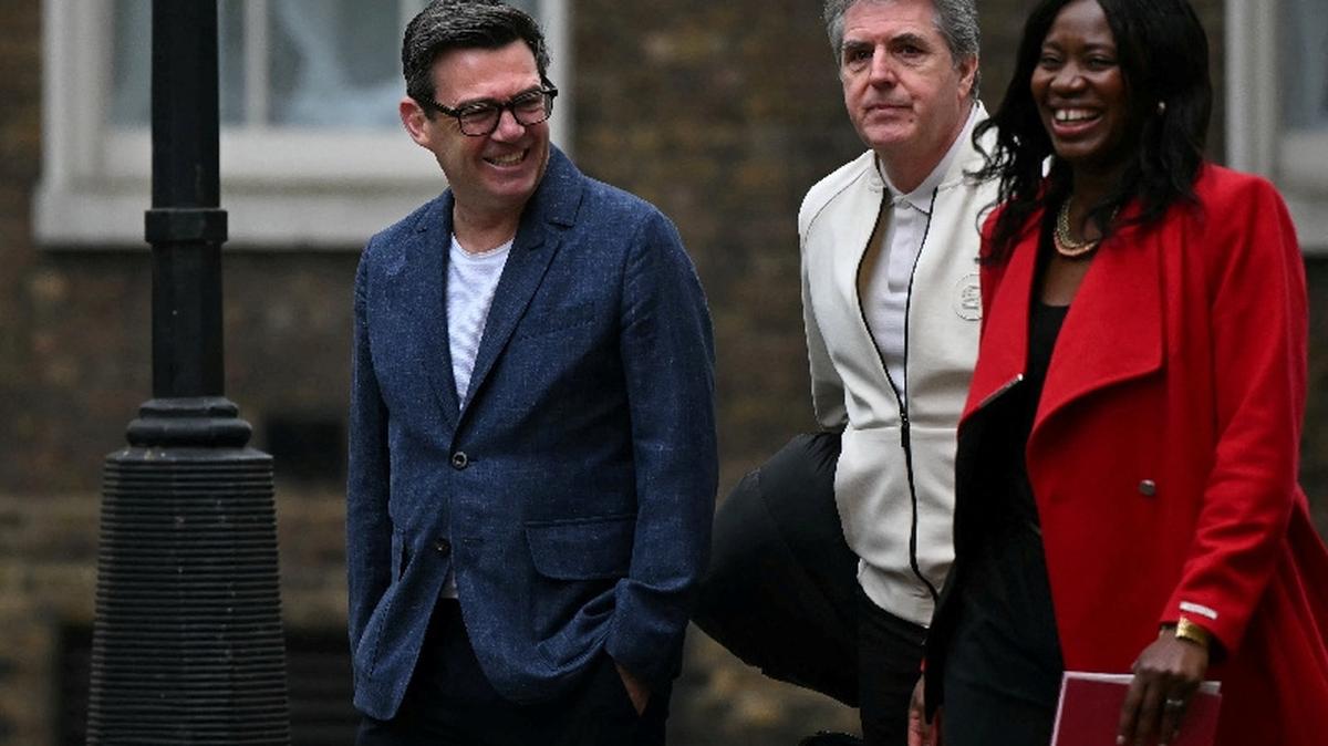 Greater Manchester Mayor Andy Burnham walks with Steve Rotheram, Mayor of Liverpool City Region, as they arrive at Downing Street in central London, Britain March 31, 2026.     JUSTIN TALLIS/Pool via REUTERS