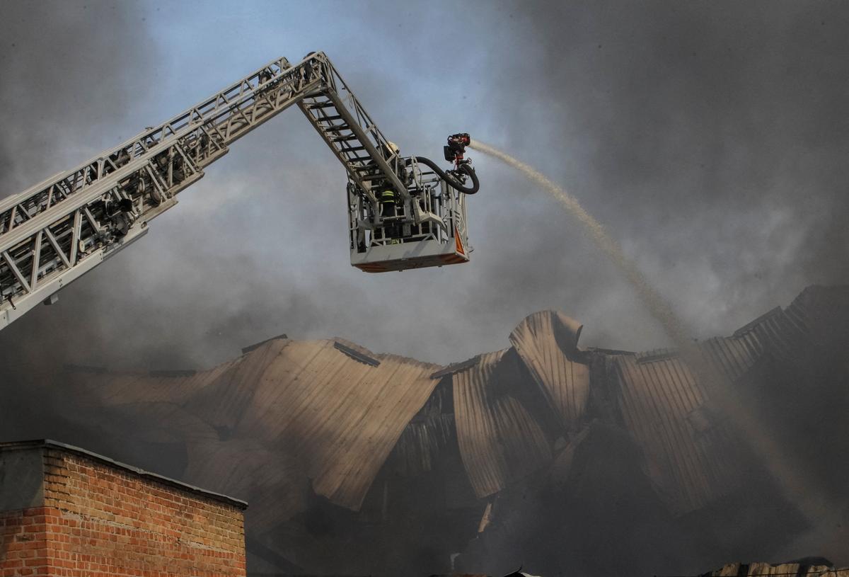 A firefighter works at a site of a Russian missile strike, amid Russia's attack on Ukraine, in Dnipro, Ukraine May 20, 2026. REUTERS/Stringer