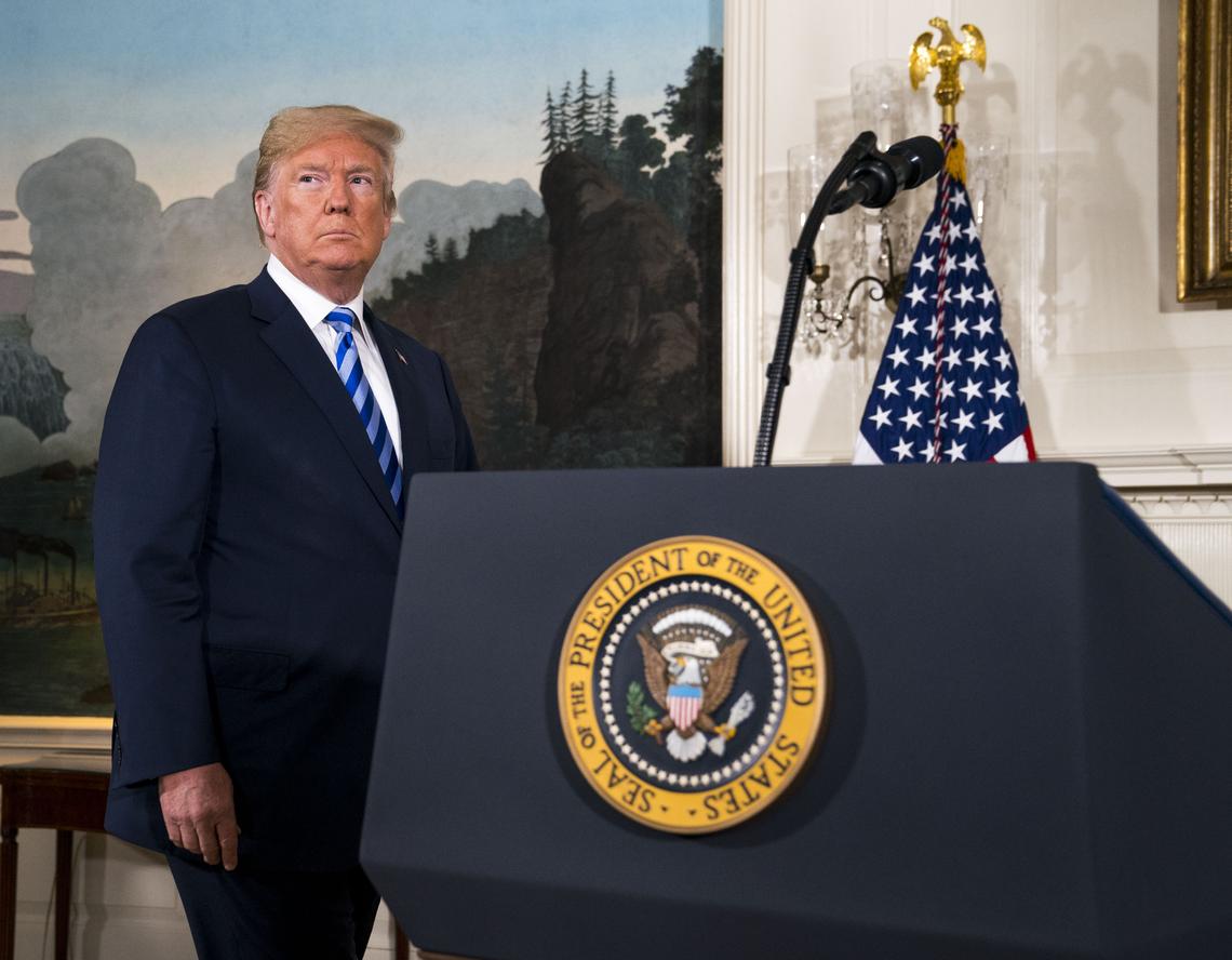 FILE -- President Donald Trump signs the proclamation withdrawing the U.S. from the Iran nuclear deal in the White House in Washington, May 8, 2018. Trump withdrew from the Obama-era nuclear accord in 2018, calling it "the worst deal ever." Iran responded with an enrichment spree that haunts the negotiations to this day. (Doug Mills/The New York Times)