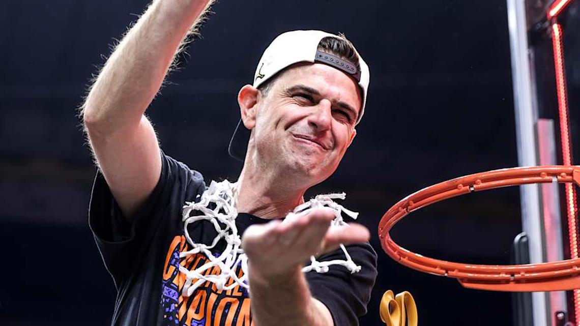  Florida Gators head coach Todd Golden chomps after leading the Florida Gators to its third championship in program history. | Kyle Lander / Gators Illustrated 