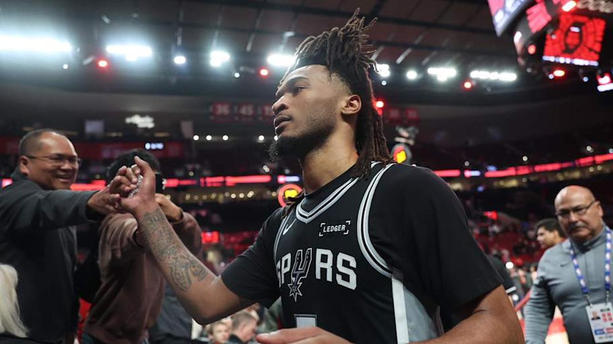  Apr 24, 2026; Portland, Oregon, USA; San Antonio Spurs guard Stephon Castle (5) high-fives fans after the Spurs defeated the Portland Trail Blazers in game three of the first round of the 2026 NBA Playoffs at Moda Center. | Jaime Valdez-Imagn Images 