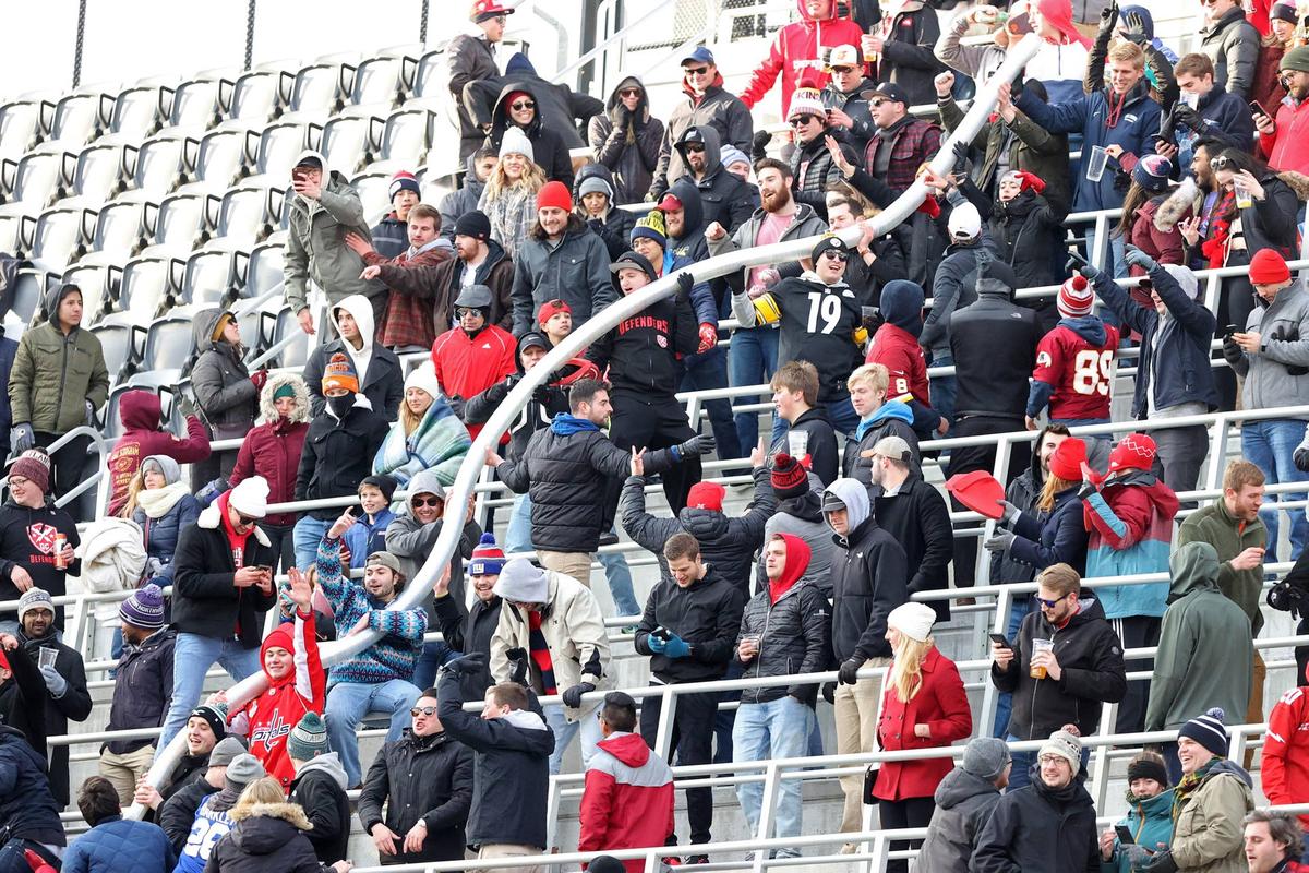  D.C. Defenders fans make a beer snake out of empty cups during an XFL game against the New York Guardians in the fourth quarter at Audi Field on Feb. 15, 2020, in Washington, D.C. © Geoff Burke-Imagn Images