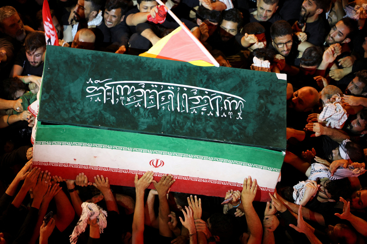 People carry the coffin of Iran's late Supreme Leader Ayatollah Ali Khamenei, who was killed on February 28 in Israeli and U.S. airstrikes, during his funeral procession, in Karbala, Iraq, July 9, 2026. REUTERS/Ahmed Saad