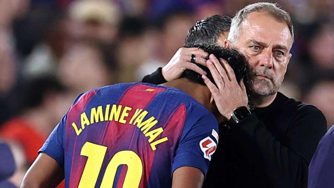  Hansi Flick (right) had a brief exchange with Yamal before he headed down the tunnel. | Josep Lago/AFP/Getty Images 