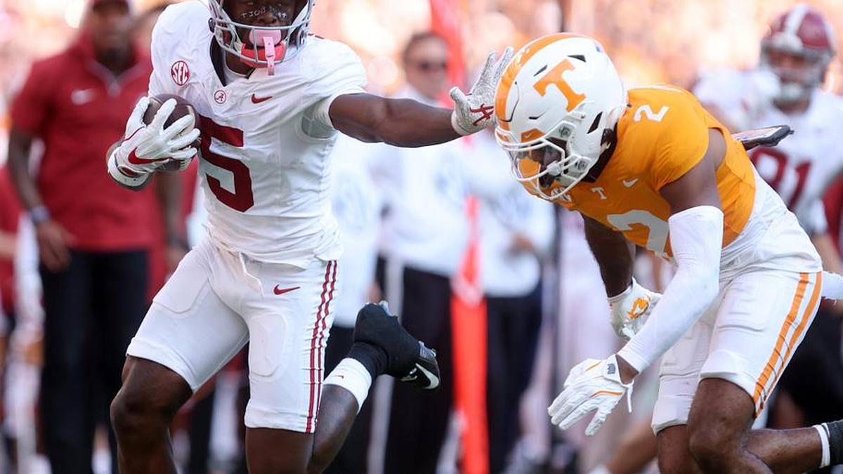  Oct 19, 2024; Knoxville, Tennessee, USA; Alabama Crimson Tide wide receiver Germie Bernard (5) runs the ball against Tennessee Volunteers defensive back Andre Turrentine (2) in the first quarter at Neyland Stadium. Mandatory Credit: Alan Poizner-Imagn Images | Alan Poizner-Imagn Images 