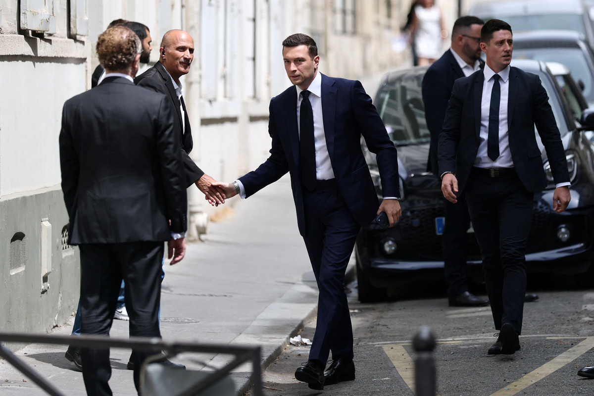 Jordan Bardella, president of the French far-right Rassemblement National (National Rally - RN) political party, arrives at the Rassemblement National headquarters before the verdict in the appeal trial of French far-right leader Marine Le Pen, member of parliament for the Rassemblement National (National Rally - RN) party, alongside the RN party itself and 10 others defendants found guilty of diverting European Parliament funds, in Paris, France, July 7, 2026.  REUTERS/Stephane Mahe