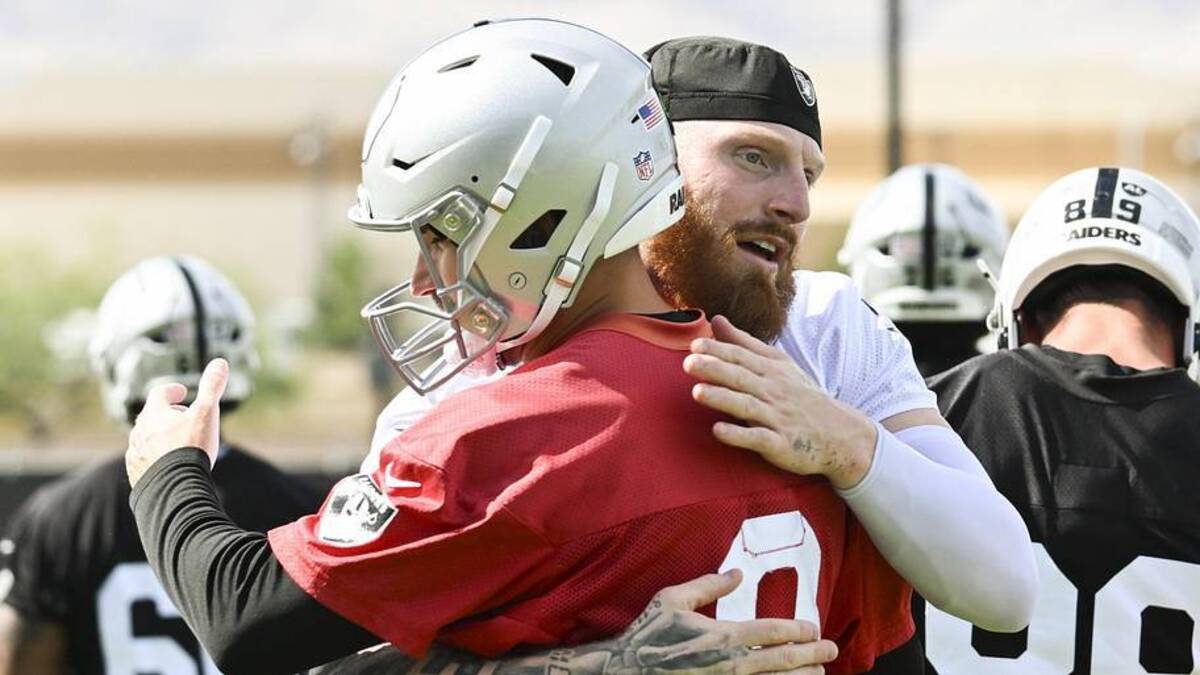  Jun 3, 2026; Henderson, NV, USA; Las Vegas Raiders defensive end Maxx Crosby (98) hugs quarterback Kirk Cousins (8) during organized team activities at Intermountain Health Performance Center. Mandatory Credit: Candice Ward-Imagn Images | Candice Ward-Imagn Images 