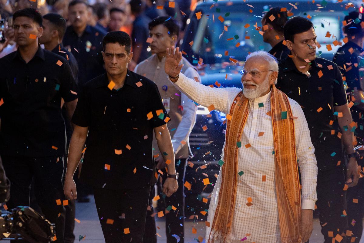 India's Prime Minister Narendra Modi greets his supporters as he arrives at the Bharatiya Janata Party (BJP) headquarters as BJP celebrates its win in the West Bengal and Assam states' assembly elections, in New Delhi, India, May 4, 2026. REUTERS/Adnan Abidi