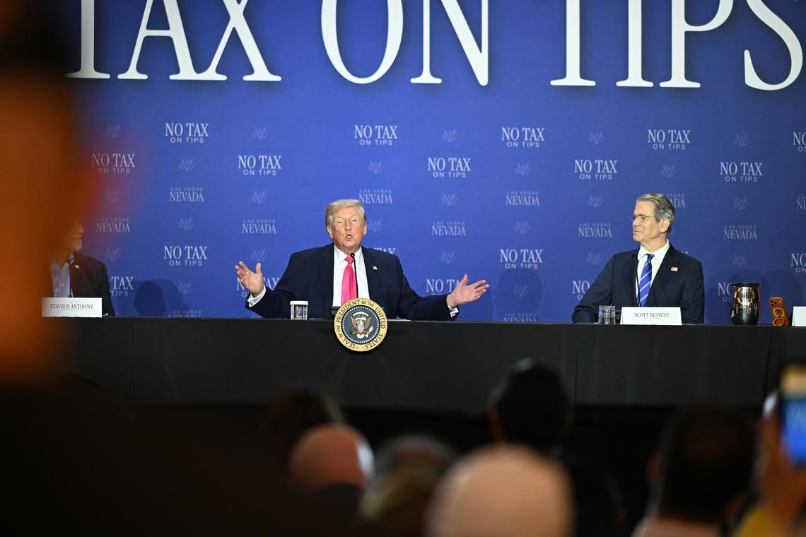 President Donald Trump, center, speaks while participating in a Tax Day roundtable at the AC Hotel Las Vegas Symphony Park in Las Vegas, on Thursday, April 16, 2026, as Nevada Lt. Gov. Stavros Anthony, center left, and Treasury Secretary Scott Bessent, center right, looks on. (Kenny Holston/The New York Times)