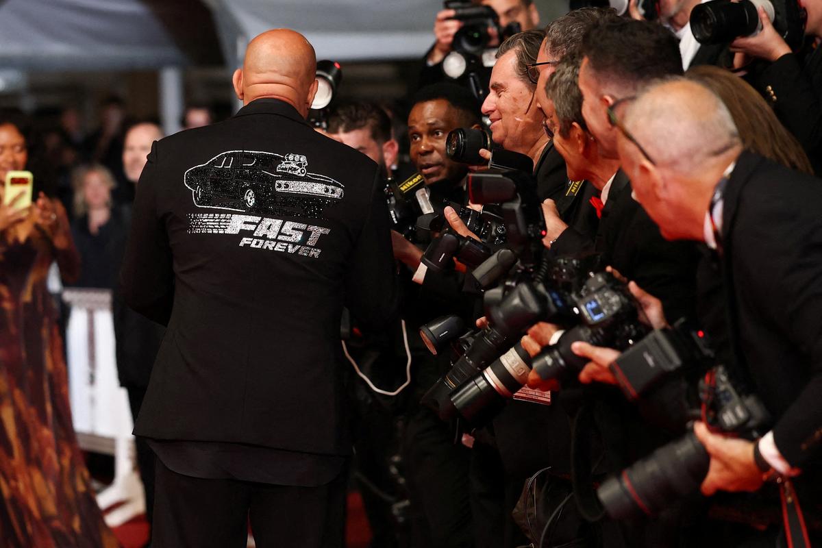 Vin Diesel speaks to photographers on the red carpet for the screening of the film "The Fast and the Furious" presented as part of Special Screenings to celebrate the 25th anniversary of "The Fast and the Furious" franchise at the 79th Cannes Film Festival in Cannes, France, May 14, 2026. REUTERS/Gonzalo Fuentes