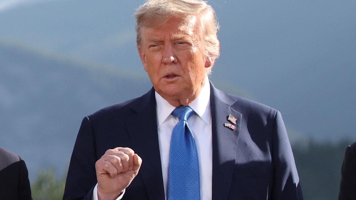 U.S. President Donald Trump gestures as he attends a family photo session during the G7 Summit, in Kananaskis, Alberta, Canada, June 16, 2025. REUTERS/Suzanne Plunkett/Pool