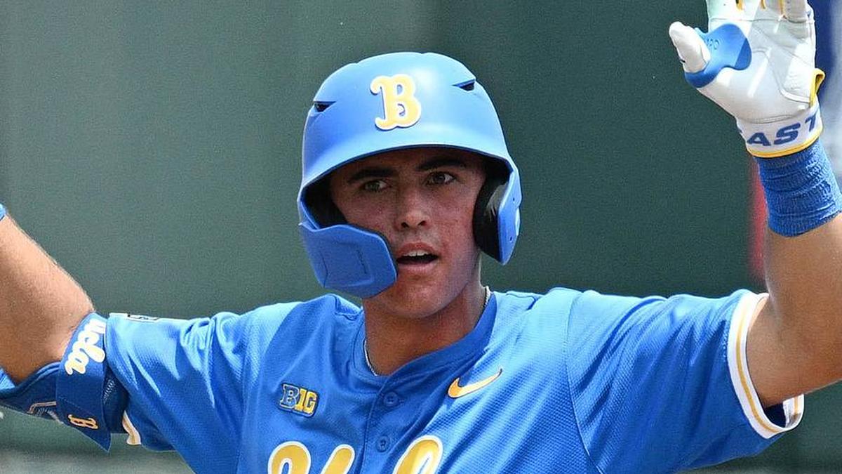  Jun 14, 2025; Omaha, Neb, USA; UCLA Bruins catcher Cashel Dugger (40) signals after hitting a double against the Murray State Racers during the second inning at Charles Schwab Field. Mandatory Credit: Steven Branscombe-Imagn Images | Steven Branscombe-Imagn Images 