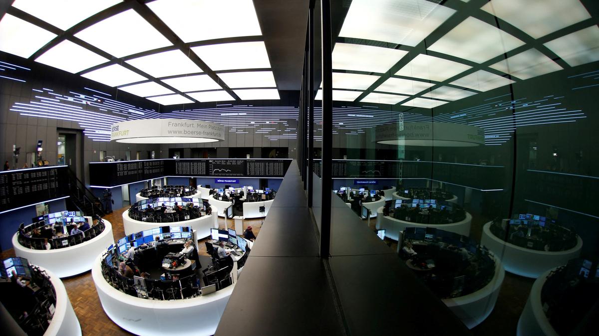 FILE PHOTO: Traders work at Frankfurt's stock exchange in Frankfurt, Germany, February 6, 2018. Picture taken with a fisheye lens. REUTERS/Ralph Orlowski/File Photo