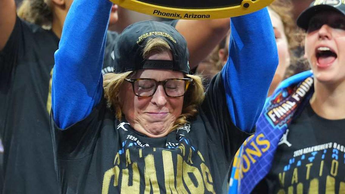 Apr 5, 2026; Phoenix, AZ, USA; UCLA Bruins head coach Cori Close celebrates with the trophy on the podium after defeating the South Carolina Gamecocks during the National Championship game of the women's 2026 NCAA Tournament at Mortgage Matchup Center. Mandatory Credit: Joe Camporeale-Imagn Images | Joe Camporeale-Imagn Images 