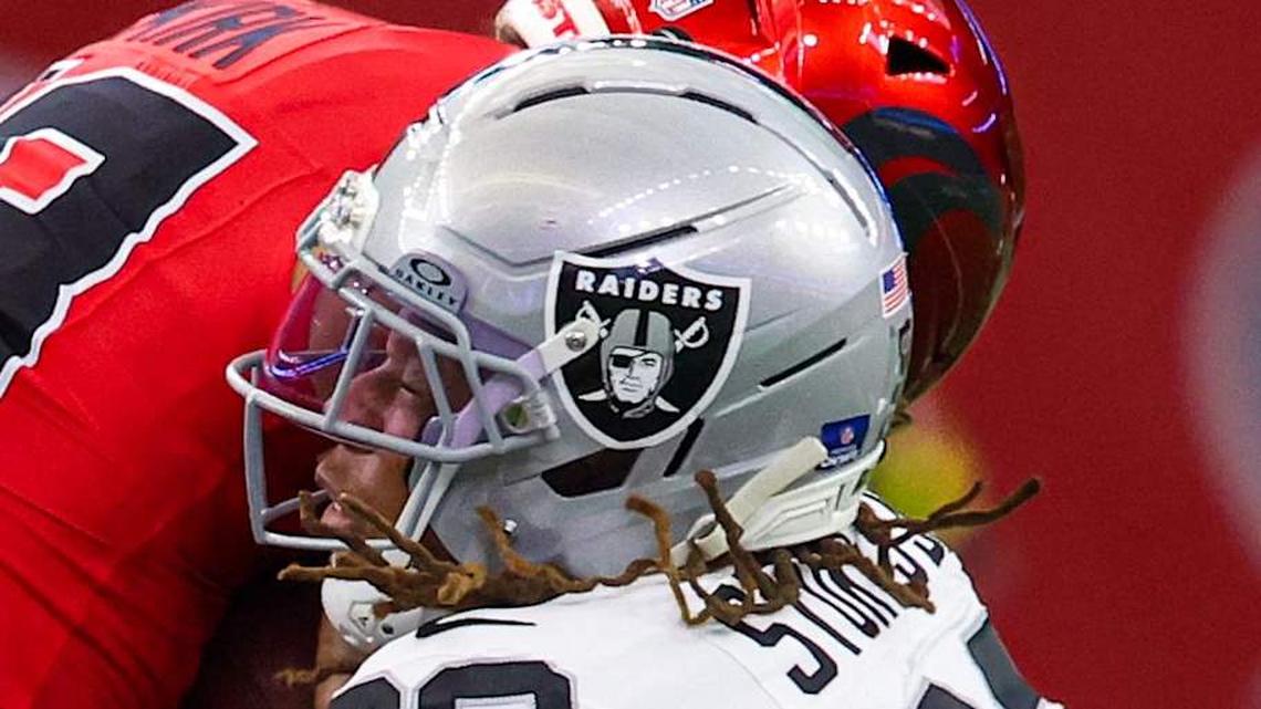  Dec 21, 2025; Houston, Texas, USA; Las Vegas Raiders cornerback Eric Stokes (22) tackles Houston Texans wide receiver Christian Kirk (13) in the first half half at NRG Stadium. Mandatory Credit: Thomas Shea-Imagn Images | Thomas Shea-Imagn Images 