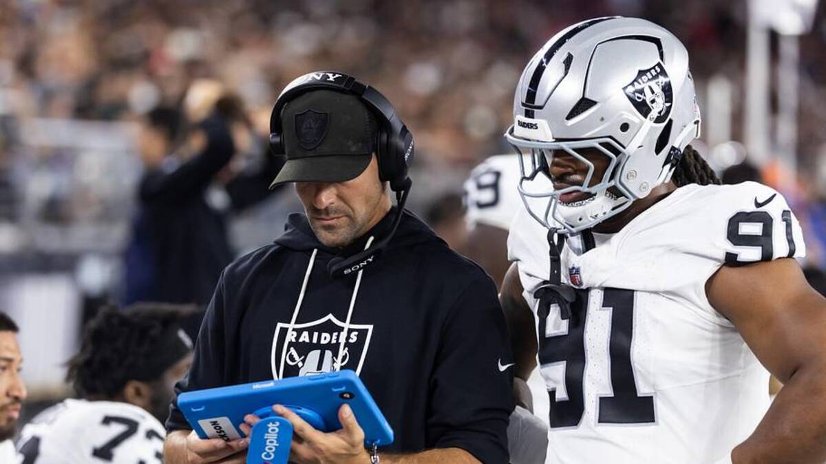  Aug 23, 2025; Glendale, Arizona, USA; Las Vegas Raiders defensive line coach Rob Leonard with defensive end Jahfari Harvey (91) against the Arizona Cardinals during a preseason NFL game at State Farm Stadium. Mandatory Credit: Mark J. Rebilas-Imagn Images | Mark J. Rebilas-Imagn Images 