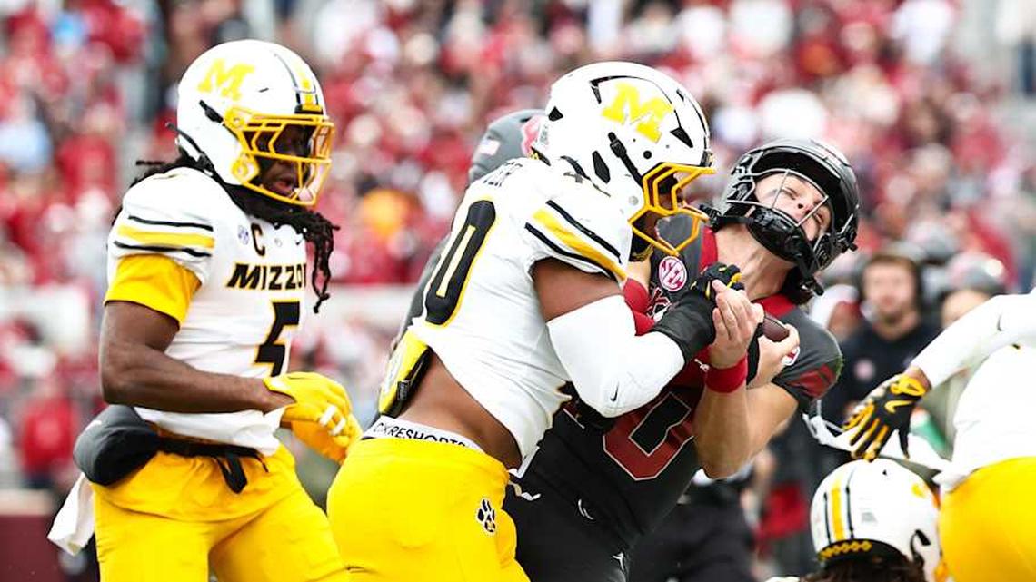  Nov 22, 2025; Norman, Oklahoma, USA; Missouri Tigers linebacker Josiah Trotter (40) tackles Oklahoma Sooners quarterback John Mateer (10) during the second quarter at Gaylord Family-Oklahoma Memorial Stadium. Mandatory Credit: Kevin Jairaj-Imagn Images | Kevin Jairaj-Imagn Images 