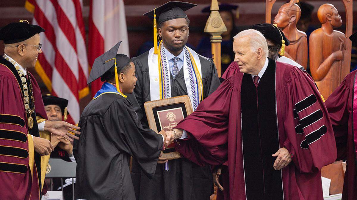 President Joe Biden shakes hands with salutatorian Dwayne Allen Terrell II at the commencement ceremony at Morehouse College in Atlanta on Sunday.