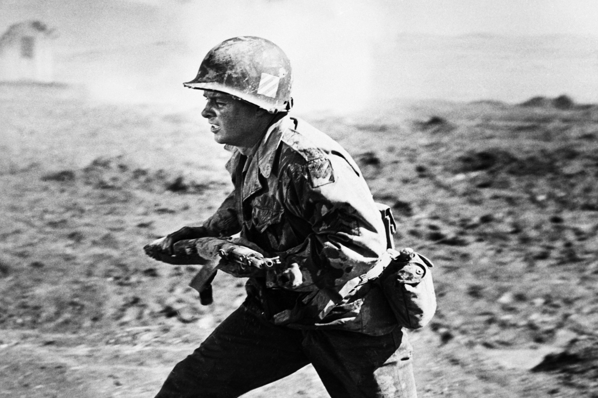  Audie Murphy, the most decorated war hero in the history of the United States reenacts some of his experiences in the European Theater of WWII in this scene from the upcoming movie To Hell And Back, an adaptation of his autobiography of the same name. Audie served 390 days in the front lines in Anzio, Sicily, France, the Rhine, the Colmar pocket, Nuremberg and Salzberg. He received 24 decorations in all including the Congressional Medal of Honor. 