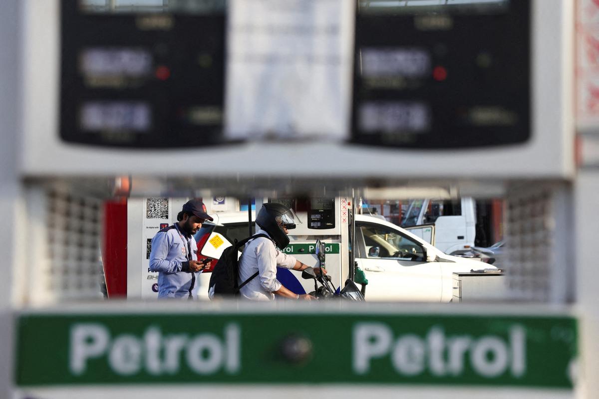 FILE PHOTO: A customer leaves after refuelling his bike at a fuel station in New Delhi, India, March 6, 2026. REUTERS/Bhawika Chhabra/File Photo