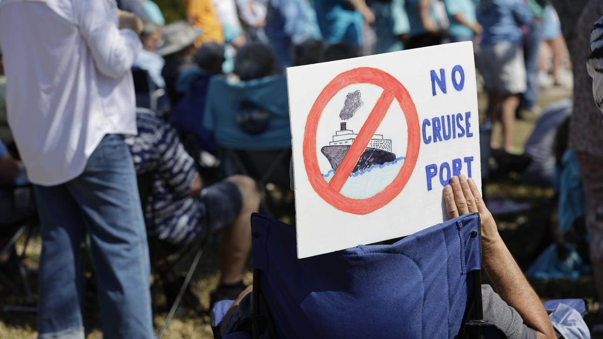 Residents opposing a proposed cruise port in Manatee County, Florida, hold up a sign during a protest Feb. 14 in Terra Ceia. (Luis Santana/Tampa Bay Times/TNS)