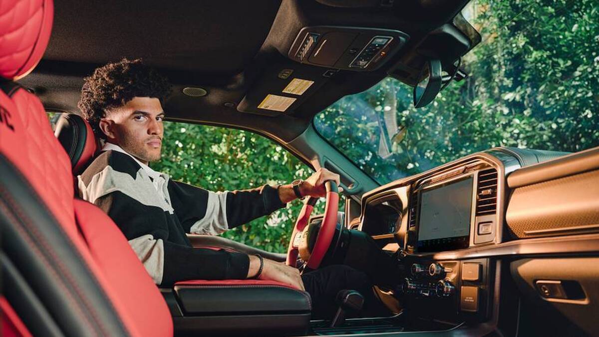  Normally not flashy, Cameron Boozer took delivery of a Ford Raptor-which his mom called his "first big-boy purchase"-during his cover shoot. | Erik Carter/Sports Illustrated; Styling creative direction by Kesha McLeod of KMCME; rugby polo by THRD; pants by Jordan Brand; necklace and bracelet by David Yurman; watch by Zenith 