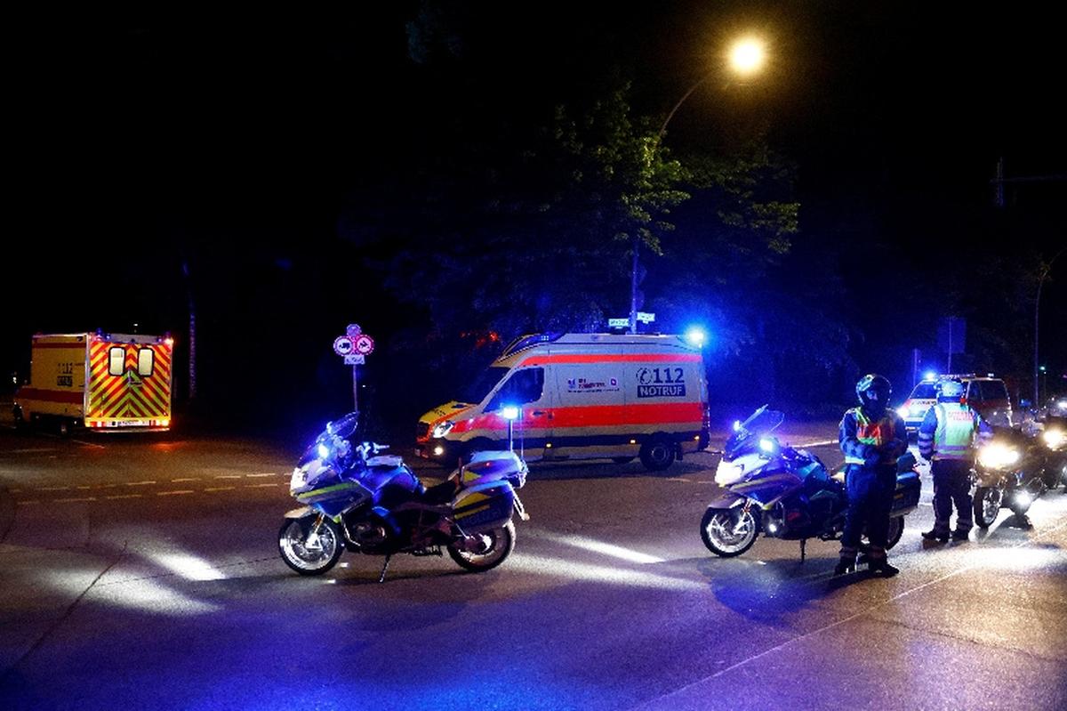 A convoy with an ambulance believed to be carrying an American health worker, who has been brought to Germany for treatment after contracting Ebola in the Democratic Republic of Congo, arrives at the Charite University Hospital in Berlin, Germany, May 20, 2026. REUTERS/Axel Schmidt