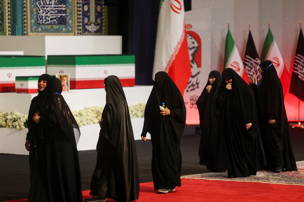 Women react near the coffins of Iran's late Supreme Leader Ayatollah Ali Khamenei and his family members, on the day international delegates participate in a farewell ceremony for Khamenei, who was killed on February 28 during Israeli and U.S. airstrikes on Iran, at the Imam Khomeini Grand Mosalla in Tehran, Iran July 3, 2026.  REUTERS/Mohammed