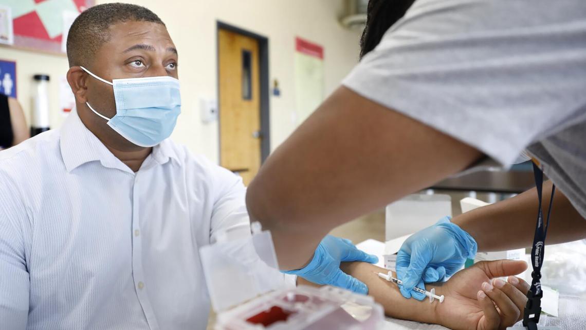 Steven Mitchell, project director with The People Concern, receives the monkeypox vaccine at a vaccination clinic to immunize people against monkeypox and COVID at The Village Mental Health Services in Los Angeles, a site run by The People Concern, on Aug. 23, 2022. (Christina House/Los Angeles Times/TNS)