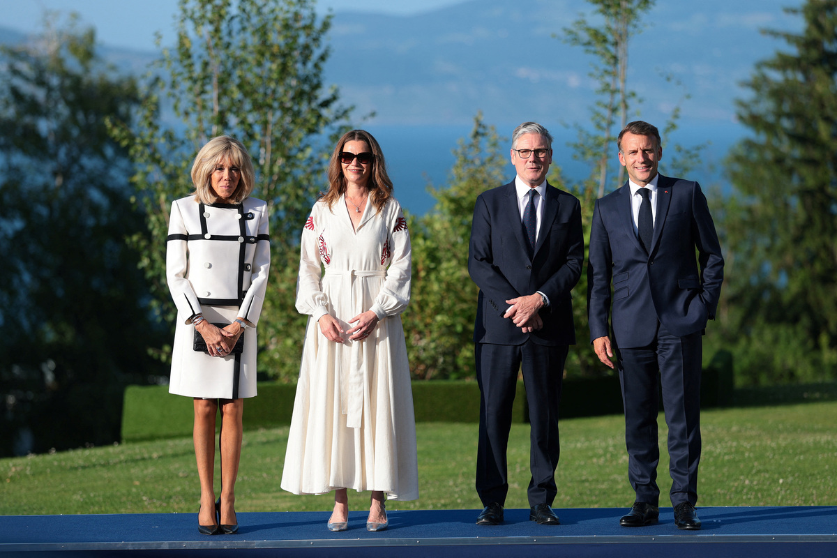 French President Emmanuel Macron and his wife, First Lady of France Brigitte Macron, welcome British Prime Minister Keir Starmer and his wife, Victoria Starmer, during the G7 summit at Hotel Royal Evian on June 15, 2026, in Evian-les-Bains, France. Anna Moneymaker/Pool via REUTERS