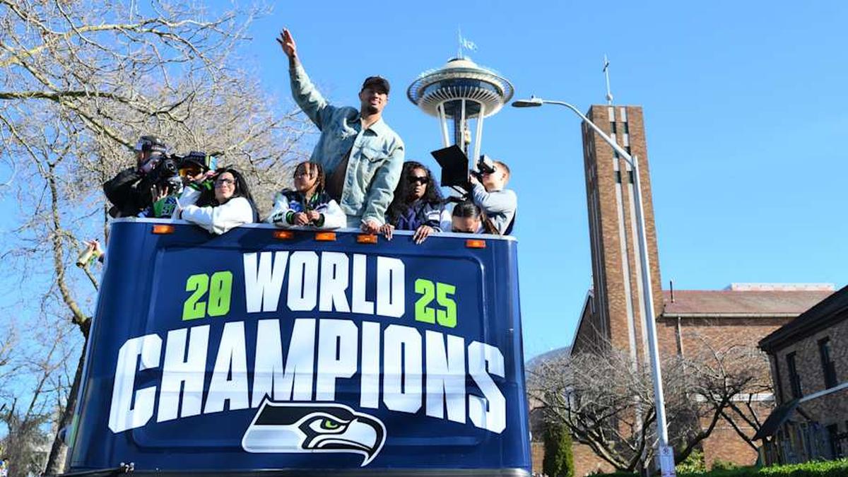  Feb 11, 2026; Seattle, WA, USA; Seattle Seahawks wide receiver Jaxon Smith-Njigba (11) interacts with fans during the Super Bowl LX World Champions parade in downtown Seattle. Mandatory Credit: Steven Bisig-Imagn Images | Steven Bisig-Imagn Images 