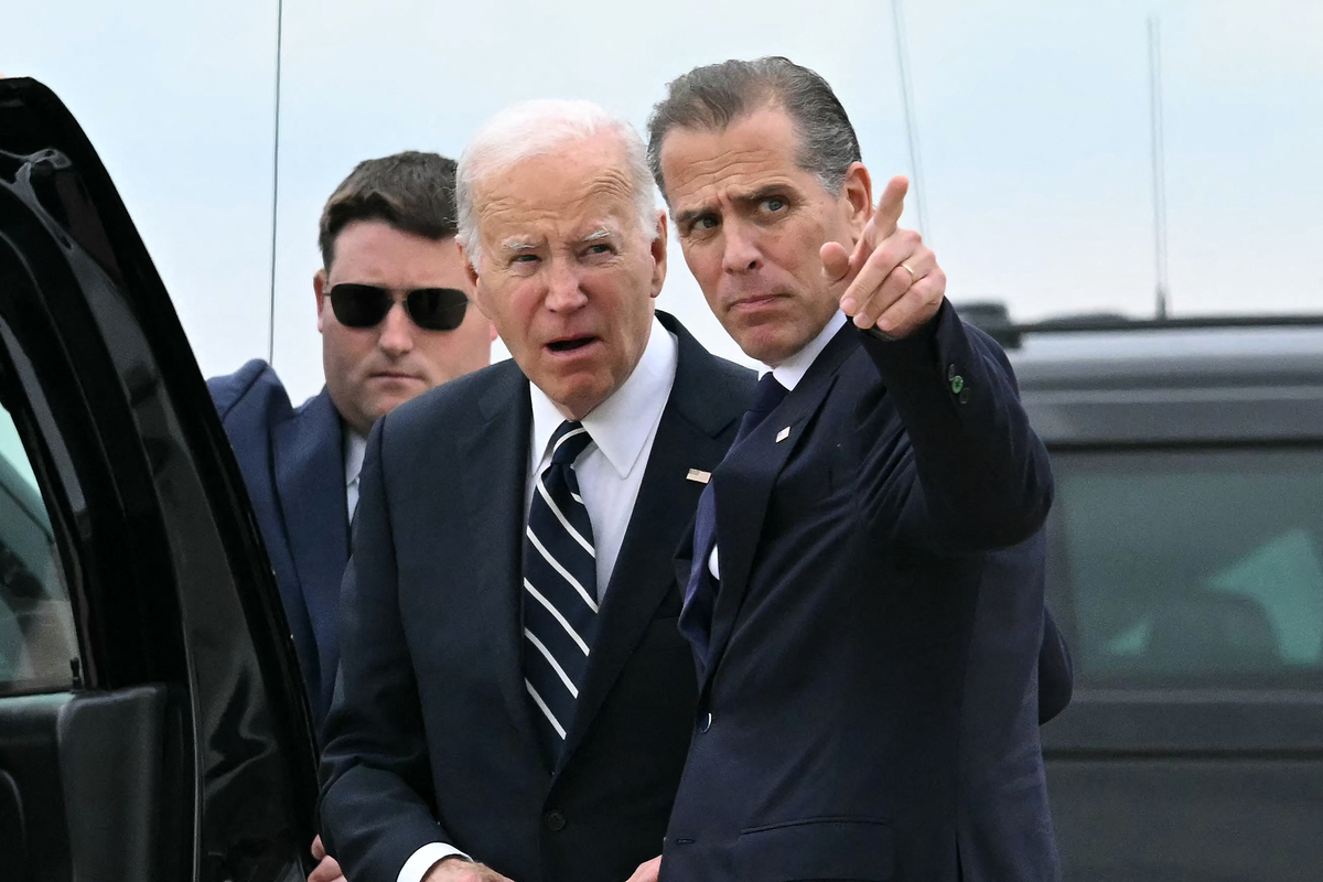  Then-President Joe Biden talks with his son Hunter Biden, pointing, upon arrival at Delaware Air National Guard Base in New Castle on June 11, 2024. (Photo by Andrew Caballero-Reynolds/AFP via Getty Images) 