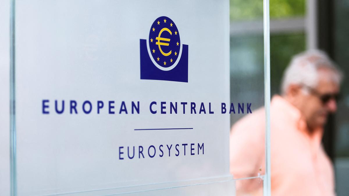 A man walks by a sign in front of the European Central Bank (ECB) building, in Frankfurt, Germany, July 21, 2022. REUTERS/Wolfgang Rattay