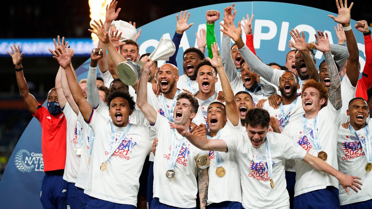 Members of the United States celebrate a 3-2 win against Mexico in extra time in the CONCACAF Nations League championship soccer match, Sunday, June 6, 2021, in Denver. (AP Photo/Jack Dempsey)